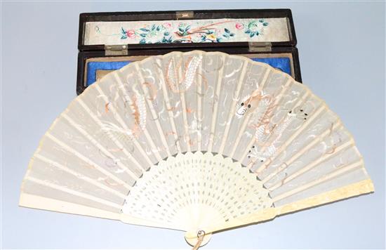 Carved ivory fan in a lacquer box